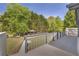 Relax on this home's spacious back deck with a view of the gazebo and large, grassy backyard at 582 Linda Ln, Powder Springs, GA 30127
