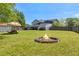 Enjoy the backyard fire pit on cool nights in your new home at 582 Linda Ln, Powder Springs, GA 30127