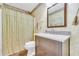 Bathroom featuring a granite vanity, a toilet, and a shower with curtain at 582 Linda Ln, Powder Springs, GA 30127
