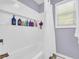 Bathroom features a tub with white tiled surround and a large shower niche at 582 Linda Ln, Powder Springs, GA 30127