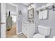 Bathroom features white vanity with marble countertop, modern fixtures, and neutral paint at 582 Linda Ln, Powder Springs, GA 30127
