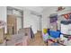 Bedroom or storage space filled with boxes, featuring light wood floors and a closet at 582 Linda Ln, Powder Springs, GA 30127