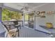 Relaxing deck area with cushioned seating and a tranquil view of the surrounding greenery at 582 Linda Ln, Powder Springs, GA 30127