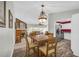 Bright dining area featuring hardwood floors, a wooden table, and chairs, ideal for Gathering meals and gatherings at 582 Linda Ln, Powder Springs, GA 30127