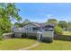 A picturesque shot of the home's backyard and exterior, complete with a deck and well-maintained lawn at 582 Linda Ln, Powder Springs, GA 30127