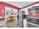 Modern kitchen with stainless steel appliances and white cabinets, offering a functional and stylish cooking space at 582 Linda Ln, Powder Springs, GA 30127