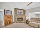 Warm and inviting living room showcasing a stone fireplace, comfortable seating, and neutral décor at 582 Linda Ln, Powder Springs, GA 30127