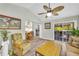 Open floor plan living room boasts wood flooring and sliding glass doors to deck at 582 Linda Ln, Powder Springs, GA 30127