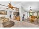 Inviting living room with a ceiling fan, cozy seating, and a dining area, perfect for relaxing and entertaining at 582 Linda Ln, Powder Springs, GA 30127