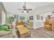 Inviting living room features a vaulted ceiling, ceiling fan and lots of natural light at 582 Linda Ln, Powder Springs, GA 30127