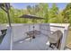 Relaxing patio featuring a table with umbrella and outdoor grill at 582 Linda Ln, Powder Springs, GA 30127
