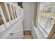 Staircase featuring carpeted steps and a white railing at 582 Linda Ln, Powder Springs, GA 30127