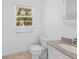 Clean bathroom with granite countertop, white fixtures, and a window, offering a functional space at 964 Crane Ne Rd, Atlanta, GA 30324