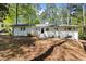 Inviting one-story home with a neatly landscaped front yard, showcasing a classic design at 964 Crane Ne Rd, Atlanta, GA 30324