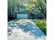 Charming single-Gathering home with stone accents, an attached garage, and a well-maintained front yard at 1462 Country Downs Dr, Norcross, GA 30093