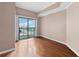 Bright bedroom featuring hardwood flooring and a sliding door to balcony at 795 Hammond Dr # 2101, Atlanta, GA 30328