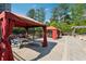 Outdoor cabana area with picnic tables and lounging area at 795 Hammond Dr # 2101, Atlanta, GA 30328