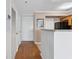 Bright condo entryway featuring hardwood floors and leading to kitchen at 795 Hammond Dr # 2101, Atlanta, GA 30328