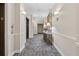 Well-lit hallway with elevator access and decorative furnishings at 795 Hammond Dr # 2101, Atlanta, GA 30328