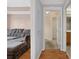 Open-concept design with hardwood floors leading to the hallway and bathroom at 795 Hammond Dr # 2101, Atlanta, GA 30328