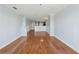 Open living area with hardwood floors leading to kitchen at 795 Hammond Dr # 2101, Atlanta, GA 30328