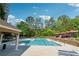 Beautiful swimming pool with lounge chairs and surrounding greenery at 795 Hammond Dr # 2101, Atlanta, GA 30328