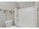 Clean shower and bathtub combination with tiled walls and shower head at 795 Hammond Dr # 2101, Atlanta, GA 30328