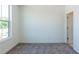 Bedroom featuring a window, neutral carpet, and white walls at 103 Iveybrooke Ln # 56, Alpharetta, GA 30009
