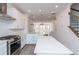 Modern kitchen with stainless steel appliances, white cabinets, and hardwood flooring at 103 Iveybrooke Ln # 56, Alpharetta, GA 30009