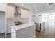 Modern kitchen with stainless steel appliances, white cabinets, and hardwood flooring at 103 Iveybrooke Ln # 56, Alpharetta, GA 30009