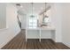Bright kitchen features an island, stainless steel appliances, and hardwood floors at 103 Iveybrooke Ln # 56, Alpharetta, GA 30009