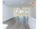Bright living room features hardwood floors and a double door leading to a balcony at 103 Iveybrooke Ln # 56, Alpharetta, GA 30009