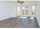 Bright living room features hardwood floors and a double door leading to a balcony at 103 Iveybrooke Ln # 56, Alpharetta, GA 30009