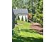 Lush backyard with manicured lawn and landscaping at 4440 Webb Bridge Rd, Alpharetta, GA 30005