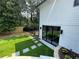 Well-maintained backyard with lush lawn and stone pathway at 4440 Webb Bridge Rd, Alpharetta, GA 30005