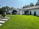 Spacious backyard with a well-maintained lawn and inviting outdoor spaces at 4440 Webb Bridge Rd, Alpharetta, GA 30005