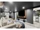 Entertainment space with a large TV, comfortable sectional, and a convenient wet bar area at 4440 Webb Bridge Rd, Alpharetta, GA 30005