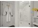 Luxurious bathroom with a walk-in glass shower, white subway tile surround, and modern fixtures at 4440 Webb Bridge Rd, Alpharetta, GA 30005
