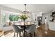 Charming breakfast nook with ample seating, natural light, and hardwood floors at 4440 Webb Bridge Rd, Alpharetta, GA 30005