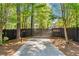 Gated driveway entrance featuring house number in a wooded setting at 4440 Webb Bridge Rd, Alpharetta, GA 30005