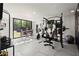 Home gym with exercise equipment and ample natural light at 4440 Webb Bridge Rd, Alpharetta, GA 30005