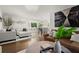 Bright open-concept living room flows to dining area, complete with hardwood floors and natural light at 4440 Webb Bridge Rd, Alpharetta, GA 30005