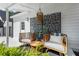 Outdoor seating area with stylish chairs and decorative screen at 4440 Webb Bridge Rd, Alpharetta, GA 30005