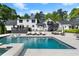 Large backyard pool and patio area with outdoor furniture, perfect for relaxing at 4440 Webb Bridge Rd, Alpharetta, GA 30005