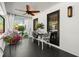 Charming porch with ceiling fan, white railings, and cozy seating area at 4440 Webb Bridge Rd, Alpharetta, GA 30005