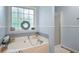 Bright bathroom with a soaking tub, glass shower, and tile accents at 57 Glenn Eagles Way, Hiram, GA 30141