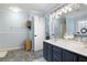 Spacious bathroom with double vanity, tile floors, and a large mirror at 57 Glenn Eagles Way, Hiram, GA 30141