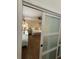 Bedroom view through a sliding door reveals stylish decor and ample natural light at 57 Glenn Eagles Way, Hiram, GA 30141
