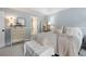 Light-blue bedroom featuring a dresser, two mirrors, and a carpeted floor at 57 Glenn Eagles Way, Hiram, GA 30141