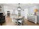 Open concept dining area near the kitchen, with a view of the white kitchen cabinets at 57 Glenn Eagles Way, Hiram, GA 30141